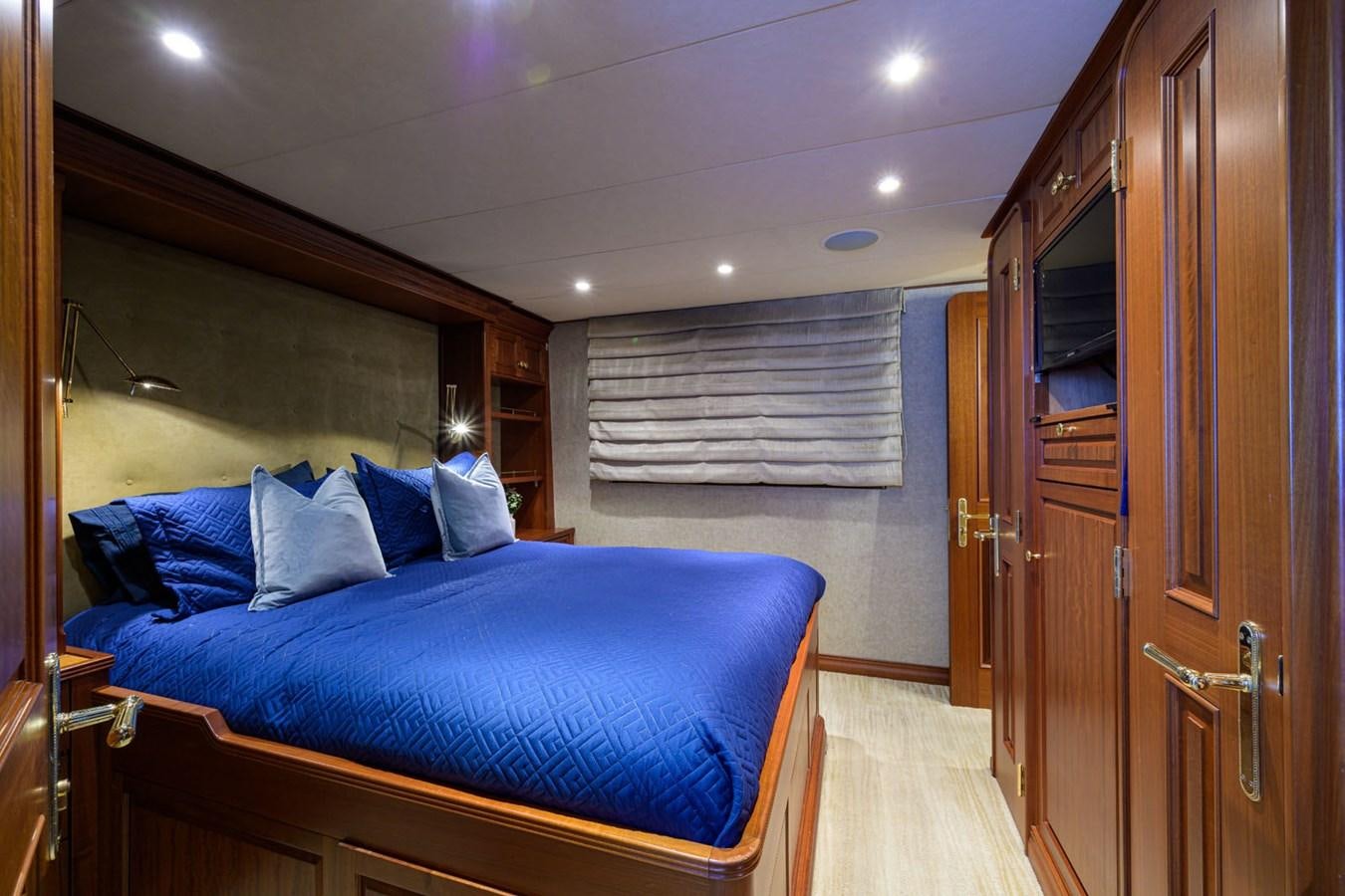 a person sitting on a bed aboard IMPETUOUS Yacht for Sale