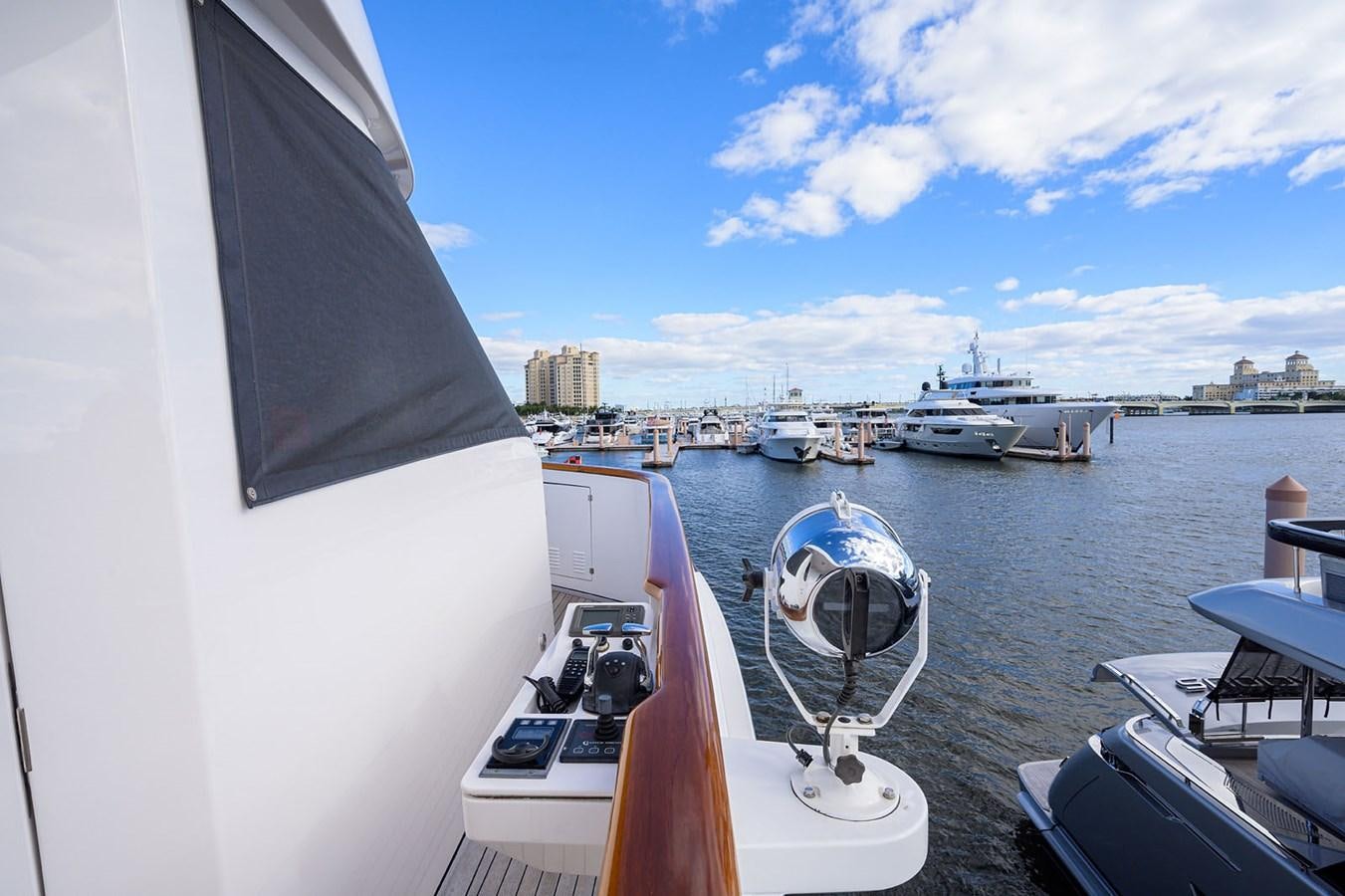 a boat is parked on the side of a river aboard IMPETUOUS Yacht for Sale
