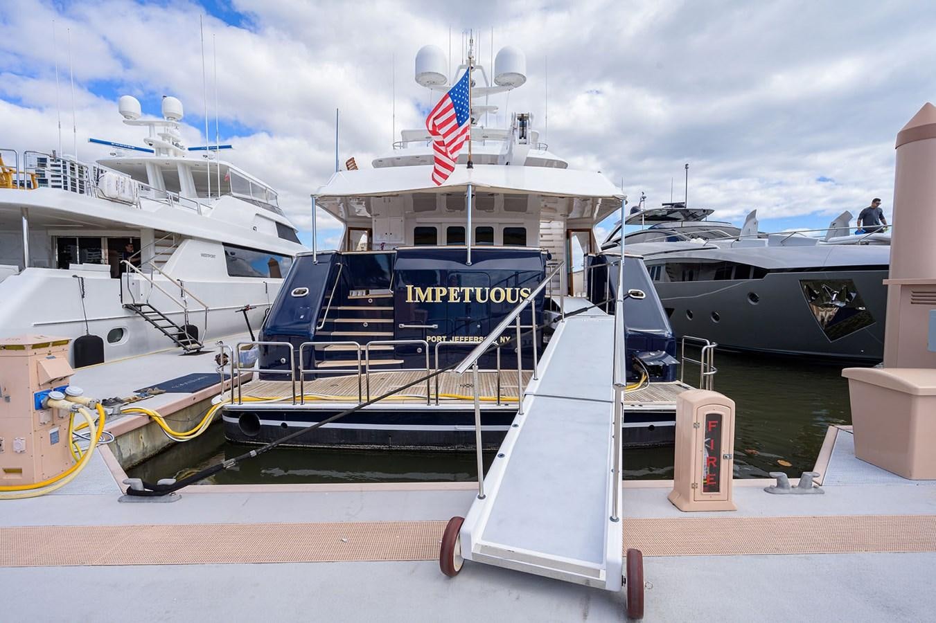 a boat docked at a pier aboard IMPETUOUS Yacht for Sale