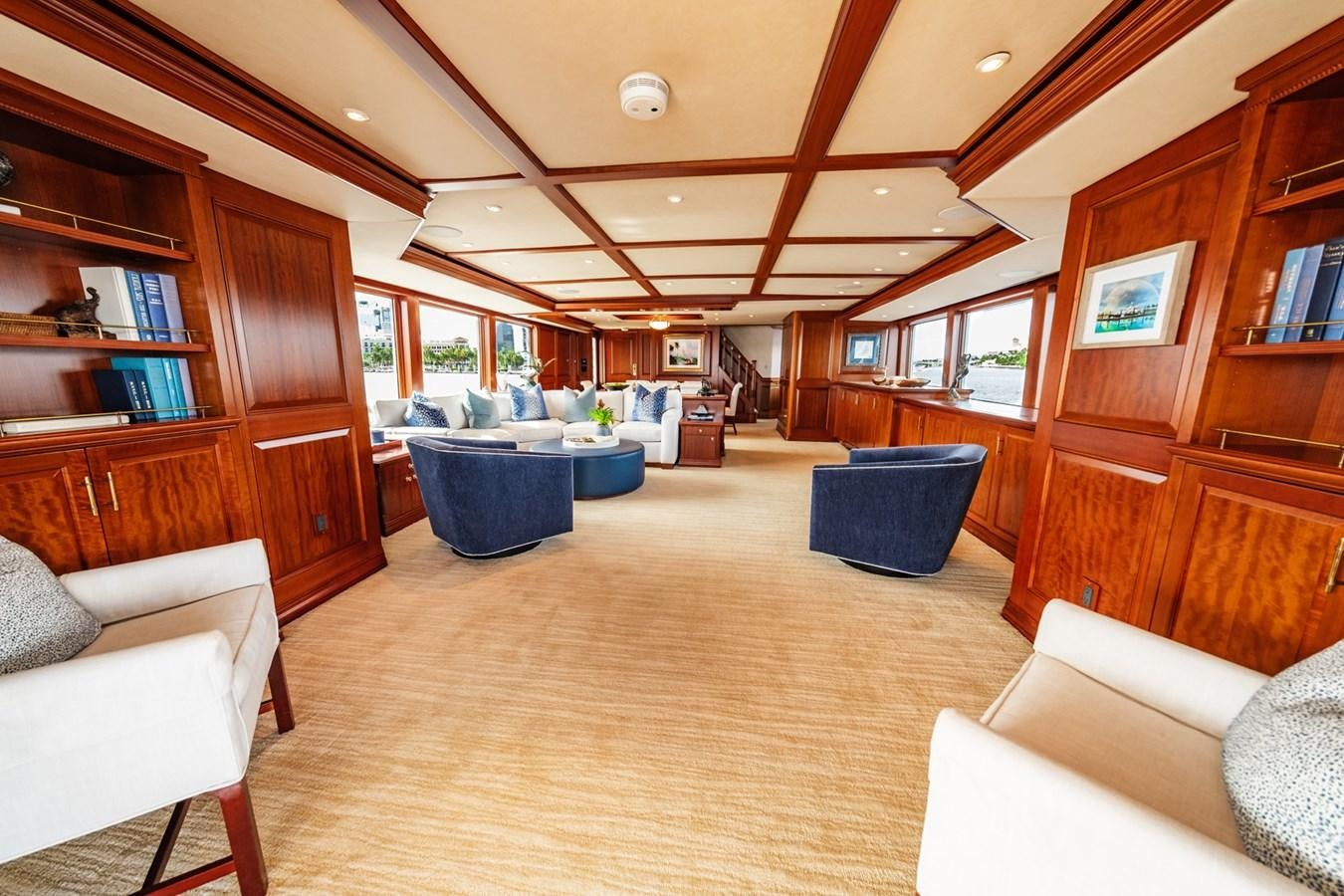 a living room with a wood paneled ceiling and a wood door aboard IMPETUOUS Yacht for Sale
