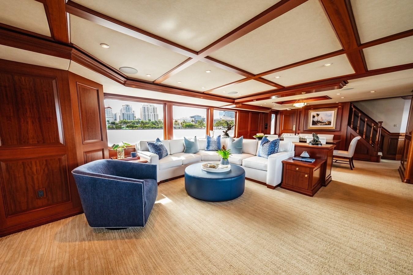 a living room with a wood floor aboard IMPETUOUS Yacht for Sale