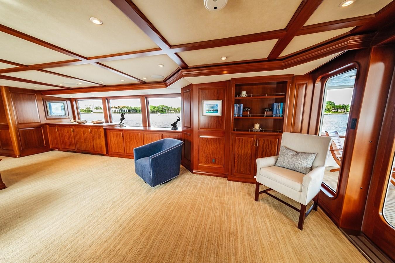 a room with a couch and a chair aboard IMPETUOUS Yacht for Sale