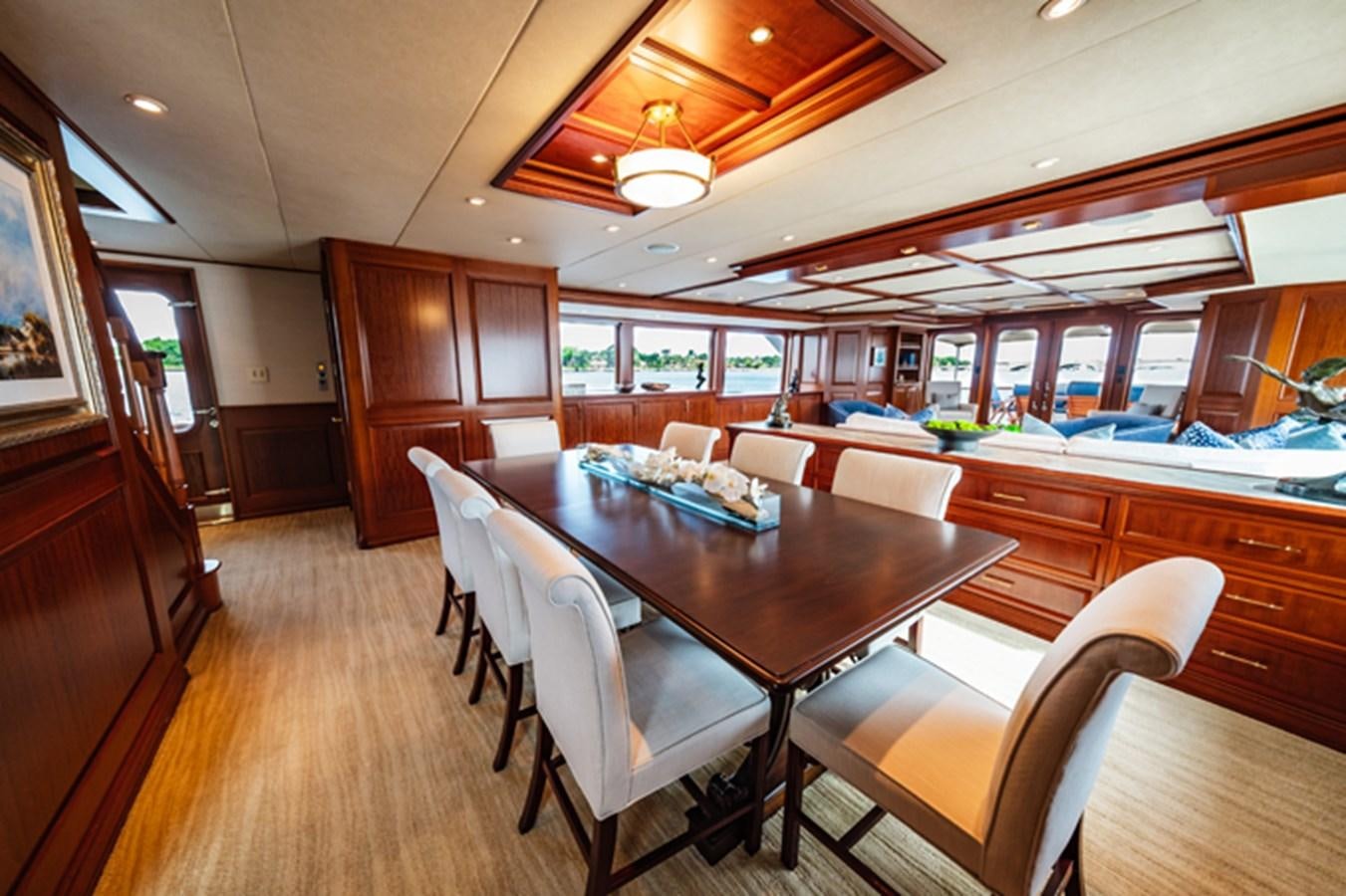 a kitchen and dining area aboard IMPETUOUS Yacht for Sale