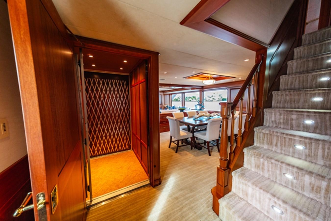 a staircase leading to a restaurant aboard IMPETUOUS Yacht for Sale