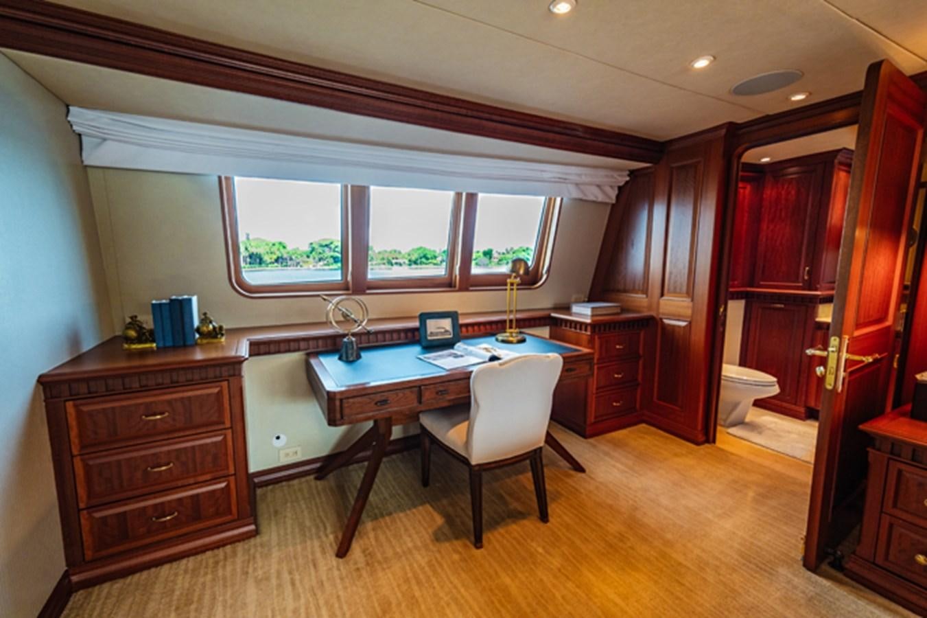 a room with a desk and a chair aboard IMPETUOUS Yacht for Sale