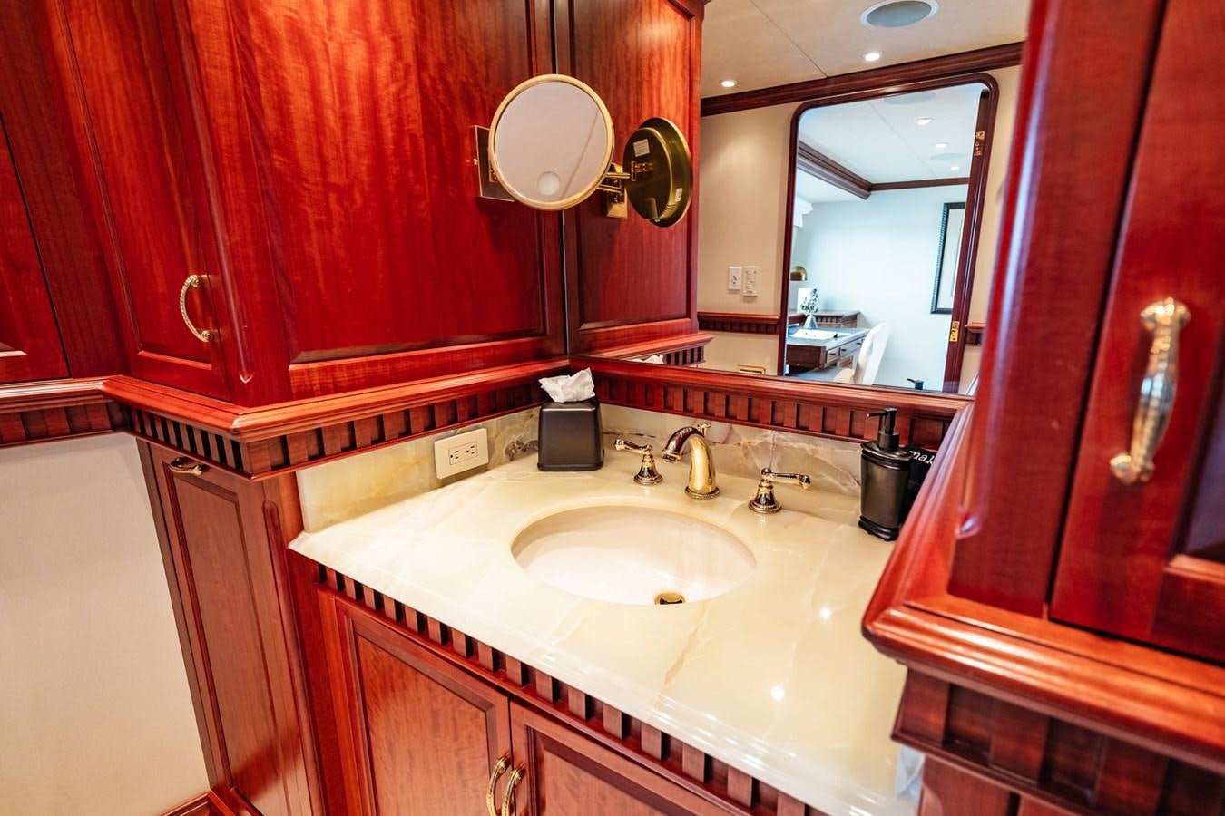 a bathroom with red walls aboard IMPETUOUS Yacht for Sale