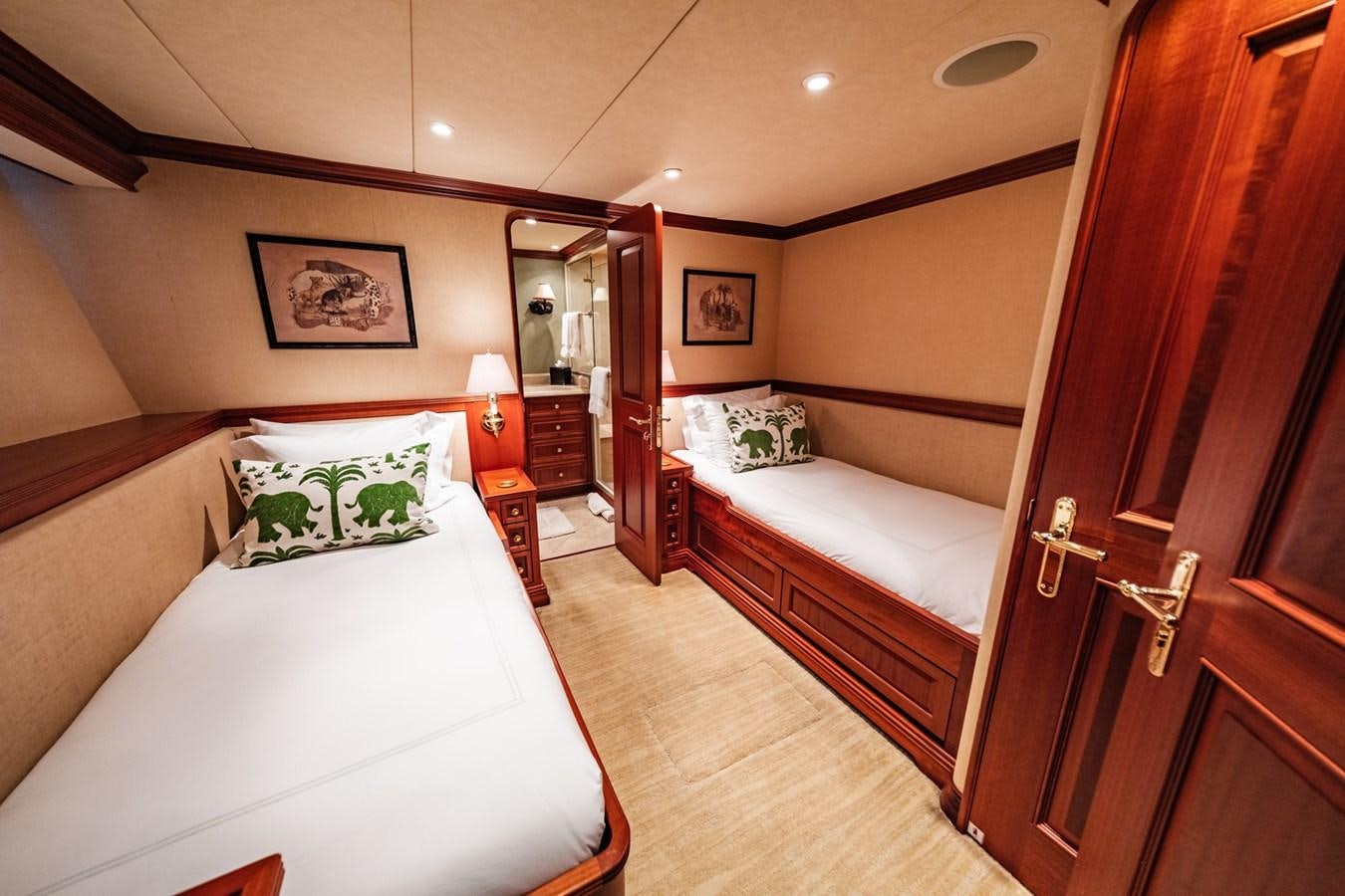 a room with a bed and a closet aboard IMPETUOUS Yacht for Sale