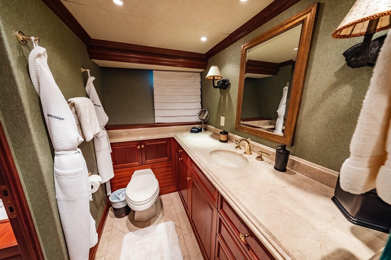 a bathroom with a large mirror aboard IMPETUOUS Yacht for Sale