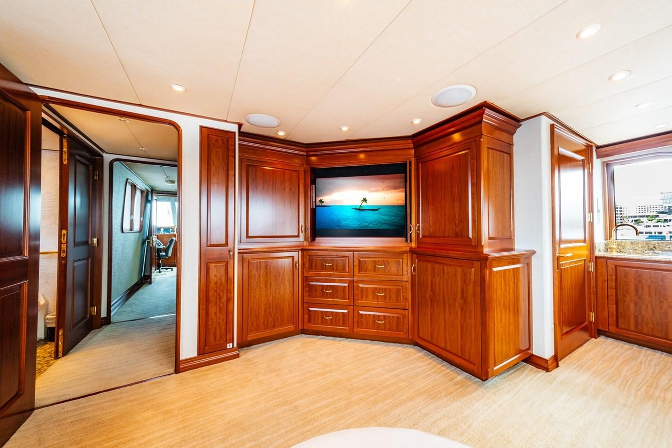 a room with wooden cabinets aboard IMPETUOUS Yacht for Sale