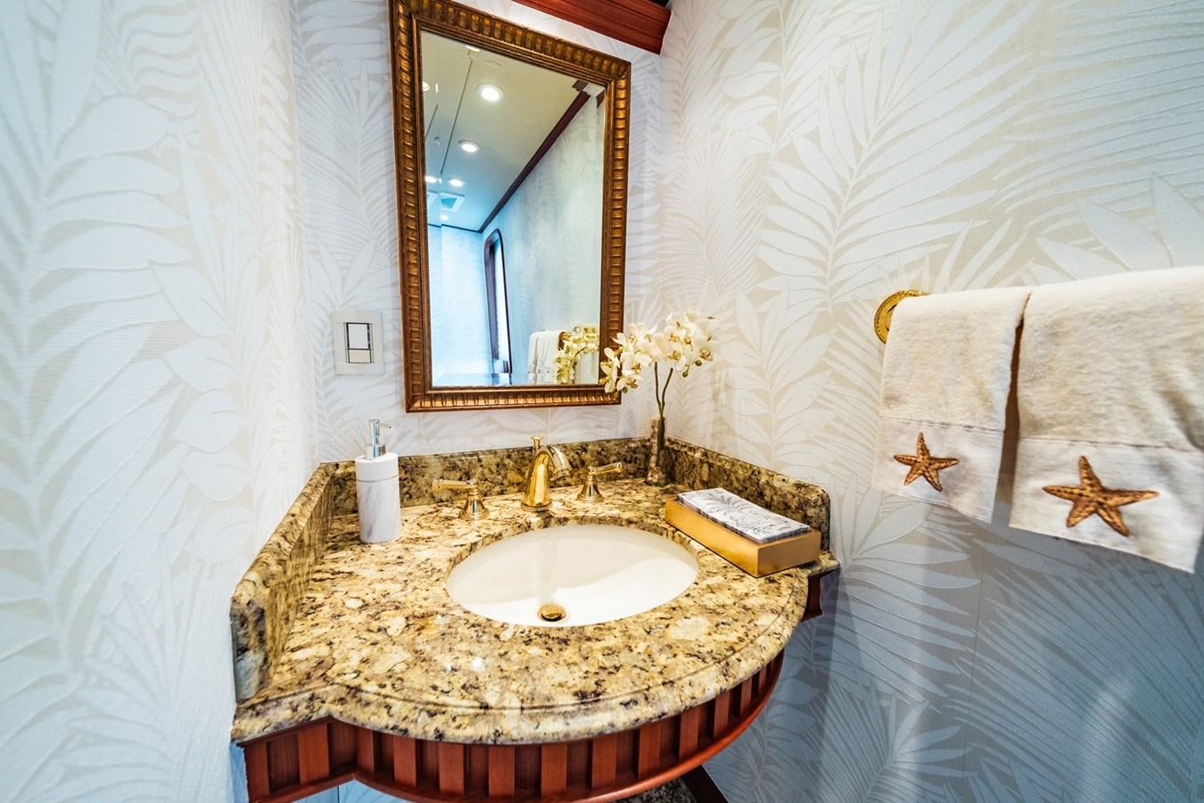 a bathroom with a marble countertop aboard IMPETUOUS Yacht for Sale