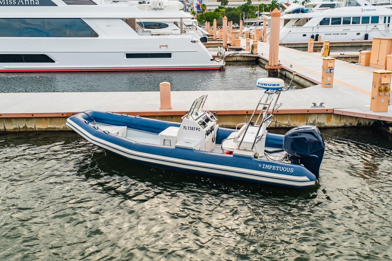 a boat is parked on the shore aboard IMPETUOUS Yacht for Sale