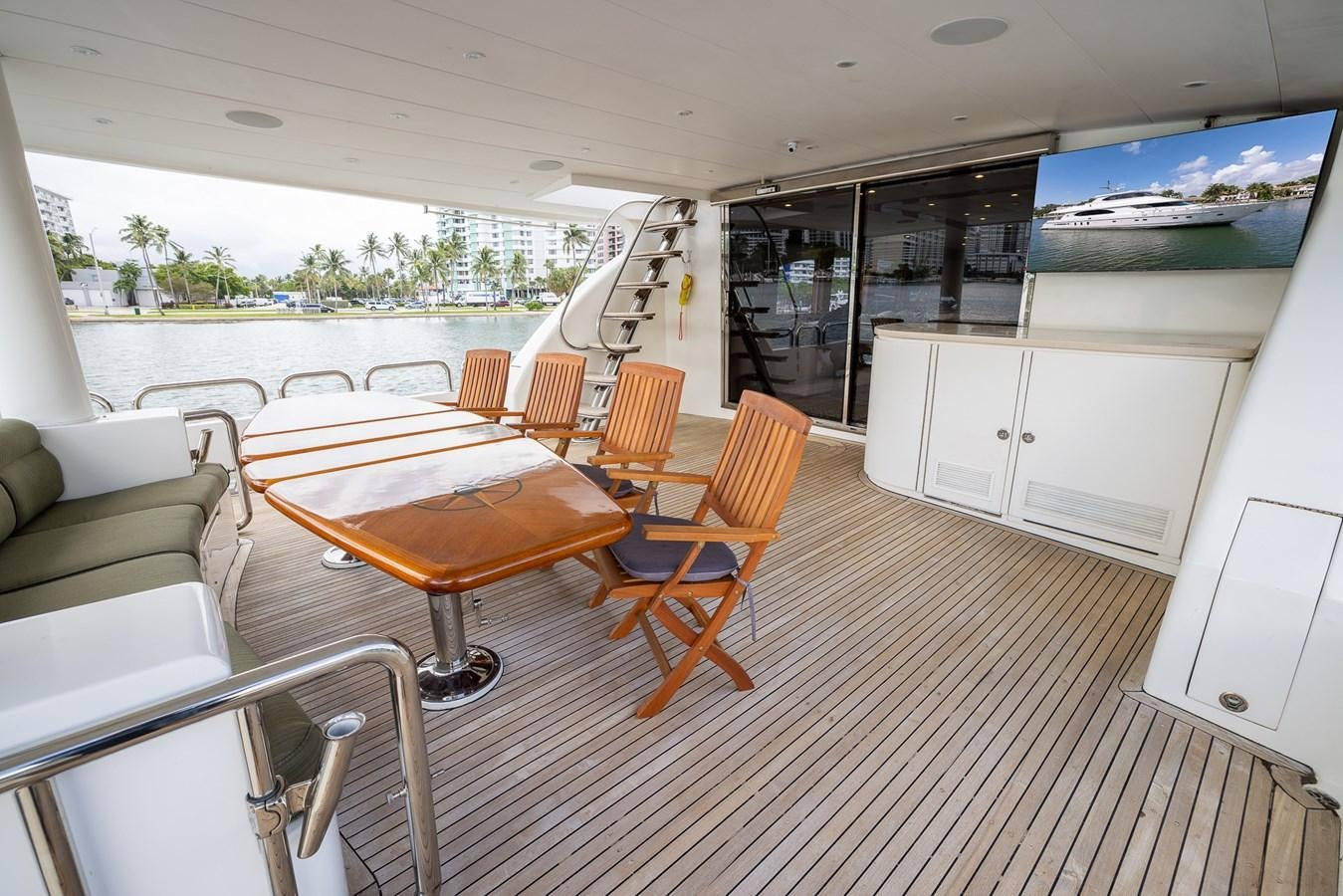 a room with tables and chairs aboard OCEAN 1 Yacht for Sale