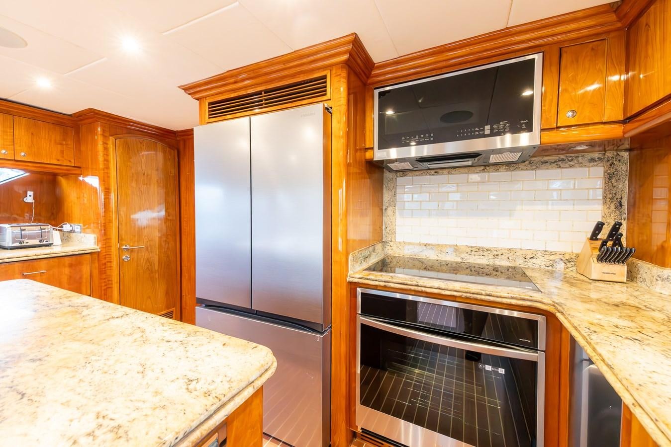a kitchen with a stainless steel oven aboard OCEAN 1 Yacht for Sale