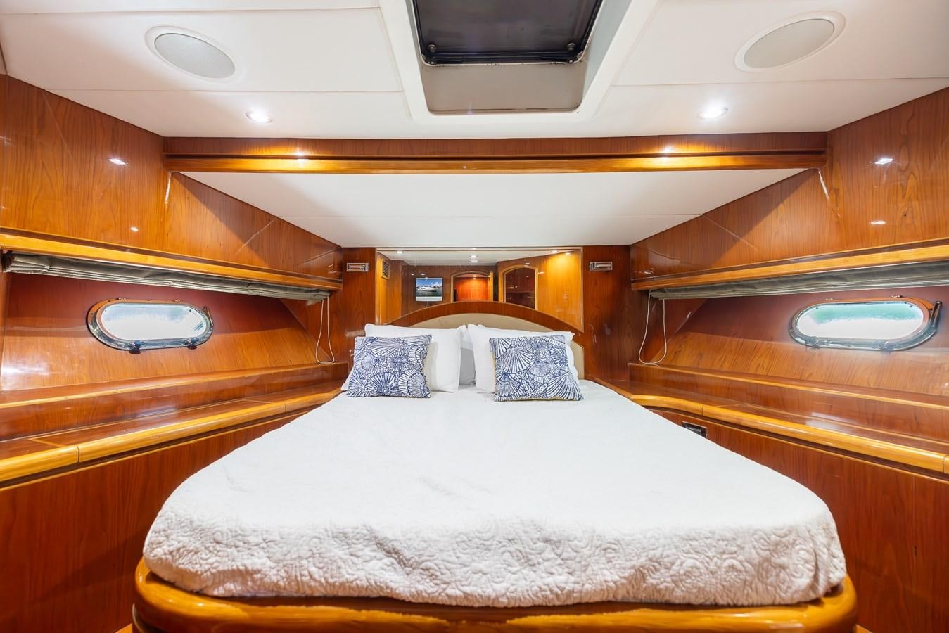 a room with a bed and a window aboard OCEAN 1 Yacht for Sale