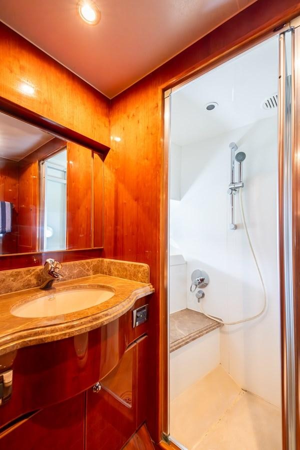 a bathroom with a sink and a shower aboard OCEAN 1 Yacht for Sale