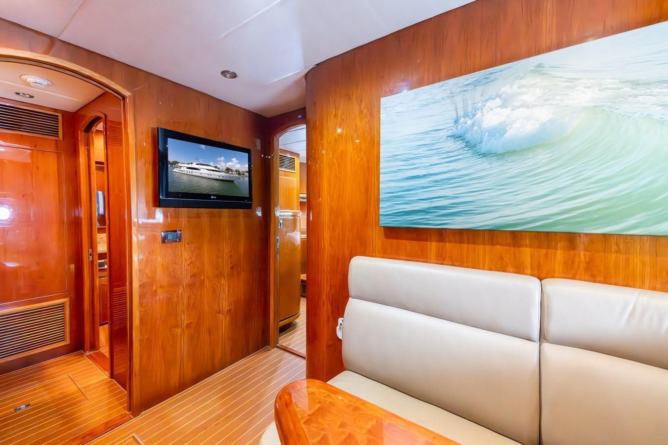 a room with a couch and a television aboard OCEAN 1 Yacht for Sale