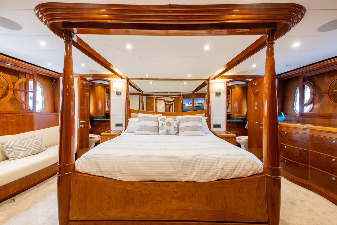 a room with a bed and a wood wall aboard OCEAN 1 Yacht for Sale