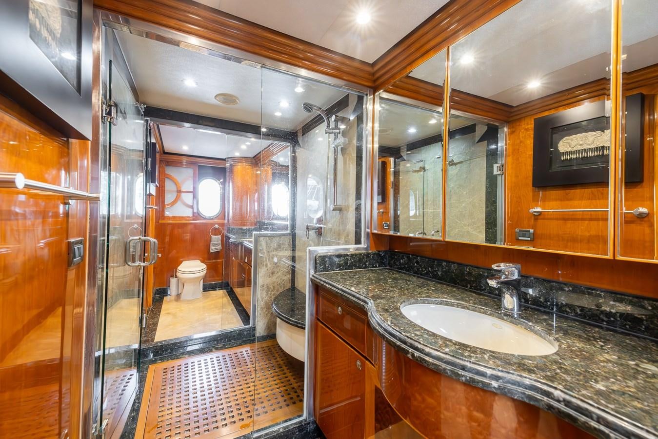 a bathroom with a large mirror aboard OCEAN 1 Yacht for Sale