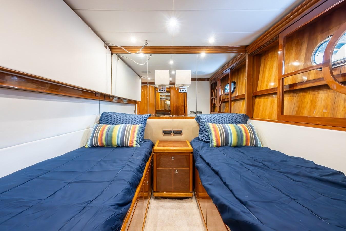 a room with two beds aboard OCEAN 1 Yacht for Sale