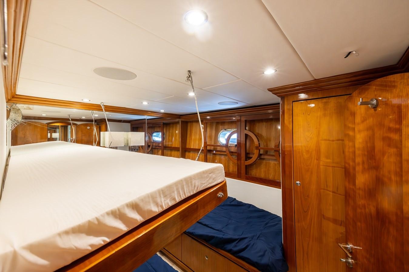 a room with a bed and a closet aboard OCEAN 1 Yacht for Sale