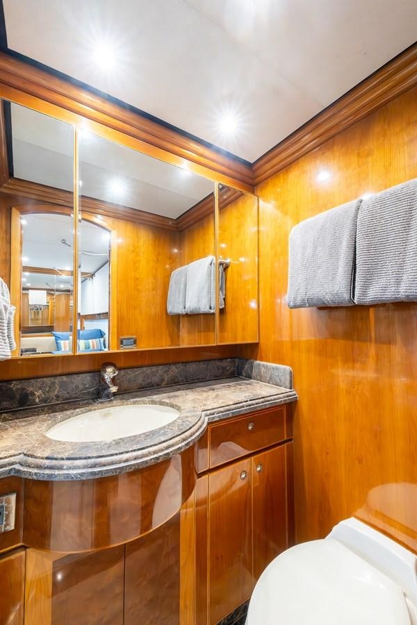 a bathroom with a sink and a mirror aboard OCEAN 1 Yacht for Sale