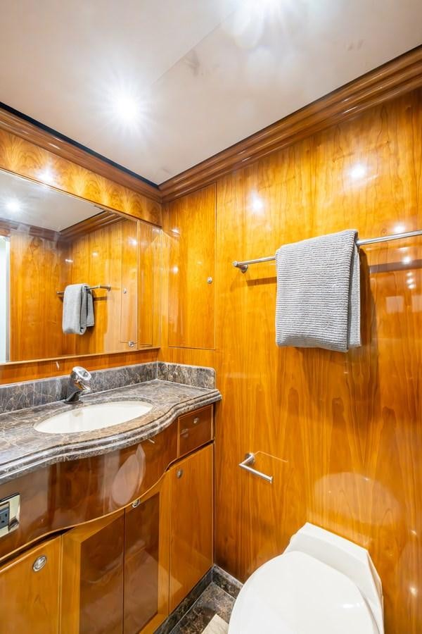 a bathroom with a sink and a mirror aboard OCEAN 1 Yacht for Sale