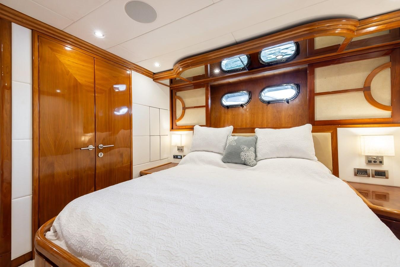a bed with pillows on it aboard OCEAN 1 Yacht for Sale