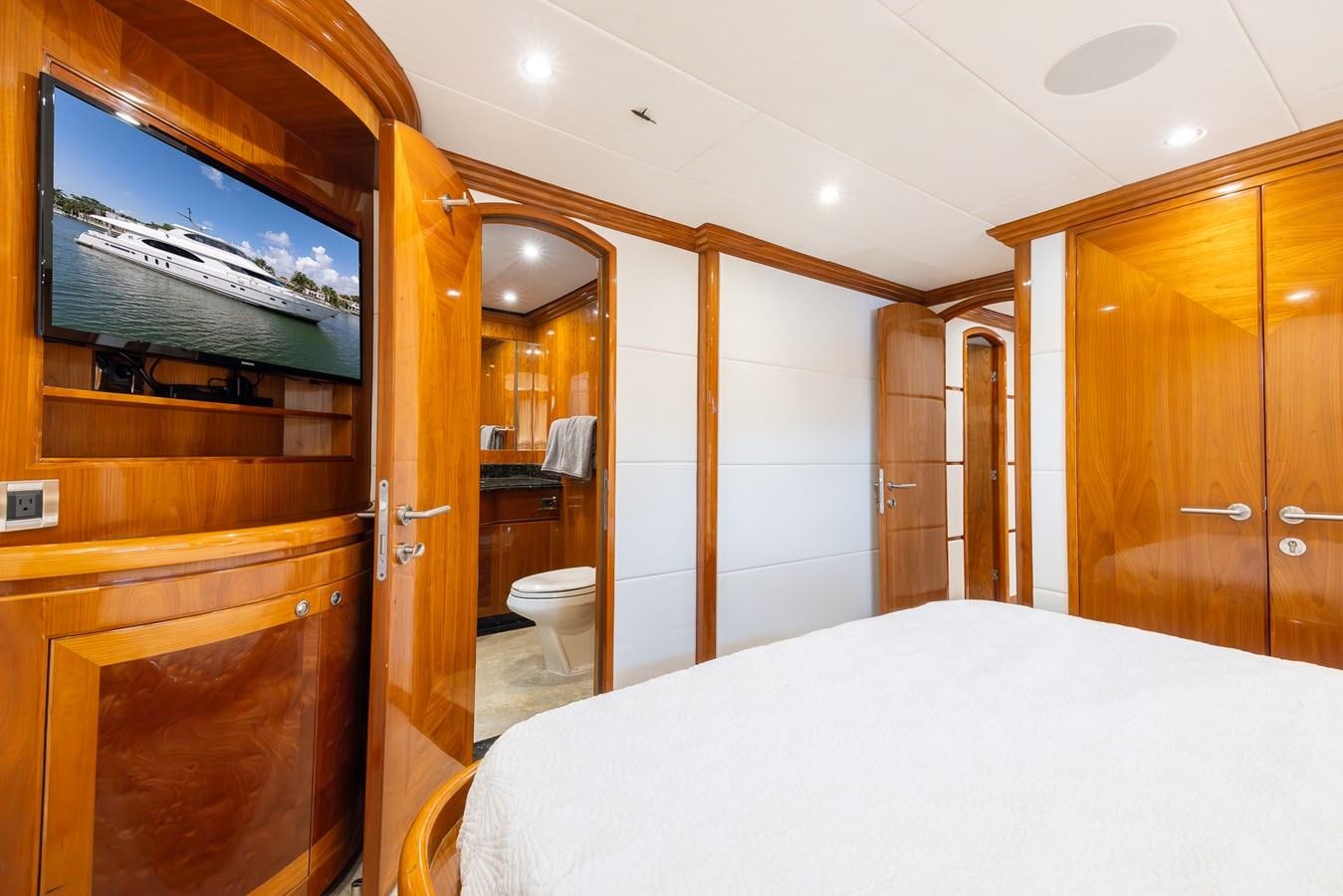 a hotel room with a large television aboard OCEAN 1 Yacht for Sale