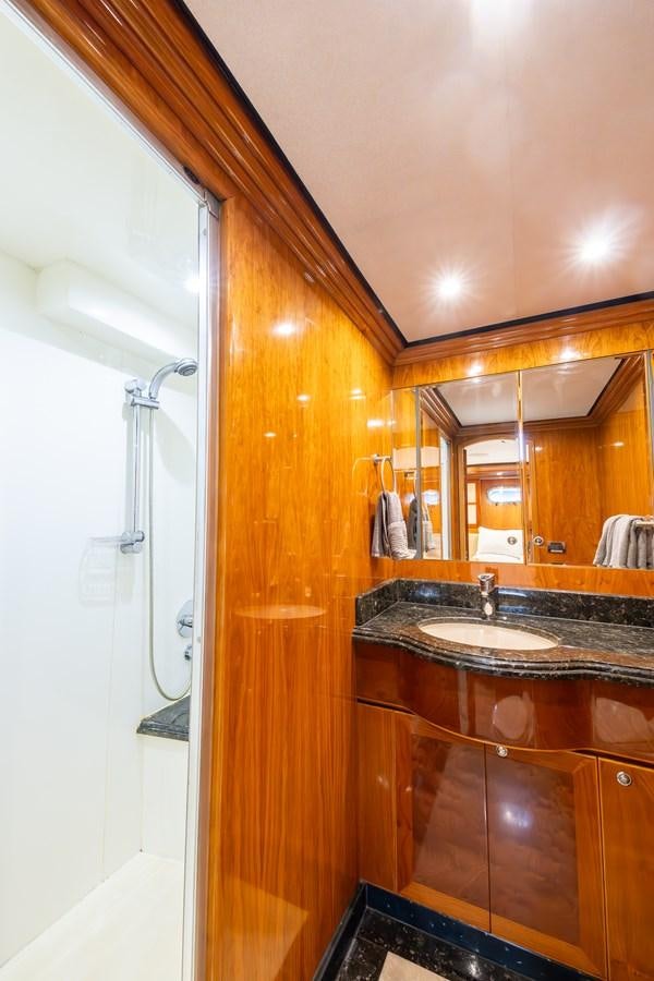 a bathroom with a sink and a mirror aboard OCEAN 1 Yacht for Sale