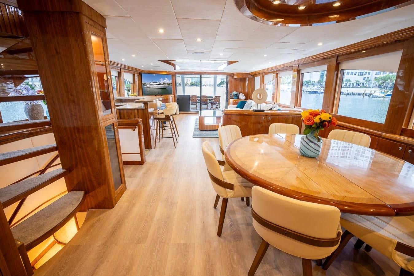 a room with tables and chairs aboard OCEAN 1 Yacht for Sale