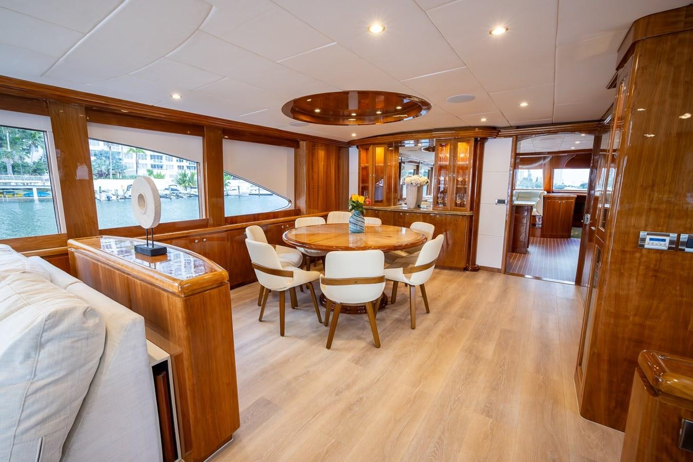 a room with a table and chairs aboard OCEAN 1 Yacht for Sale