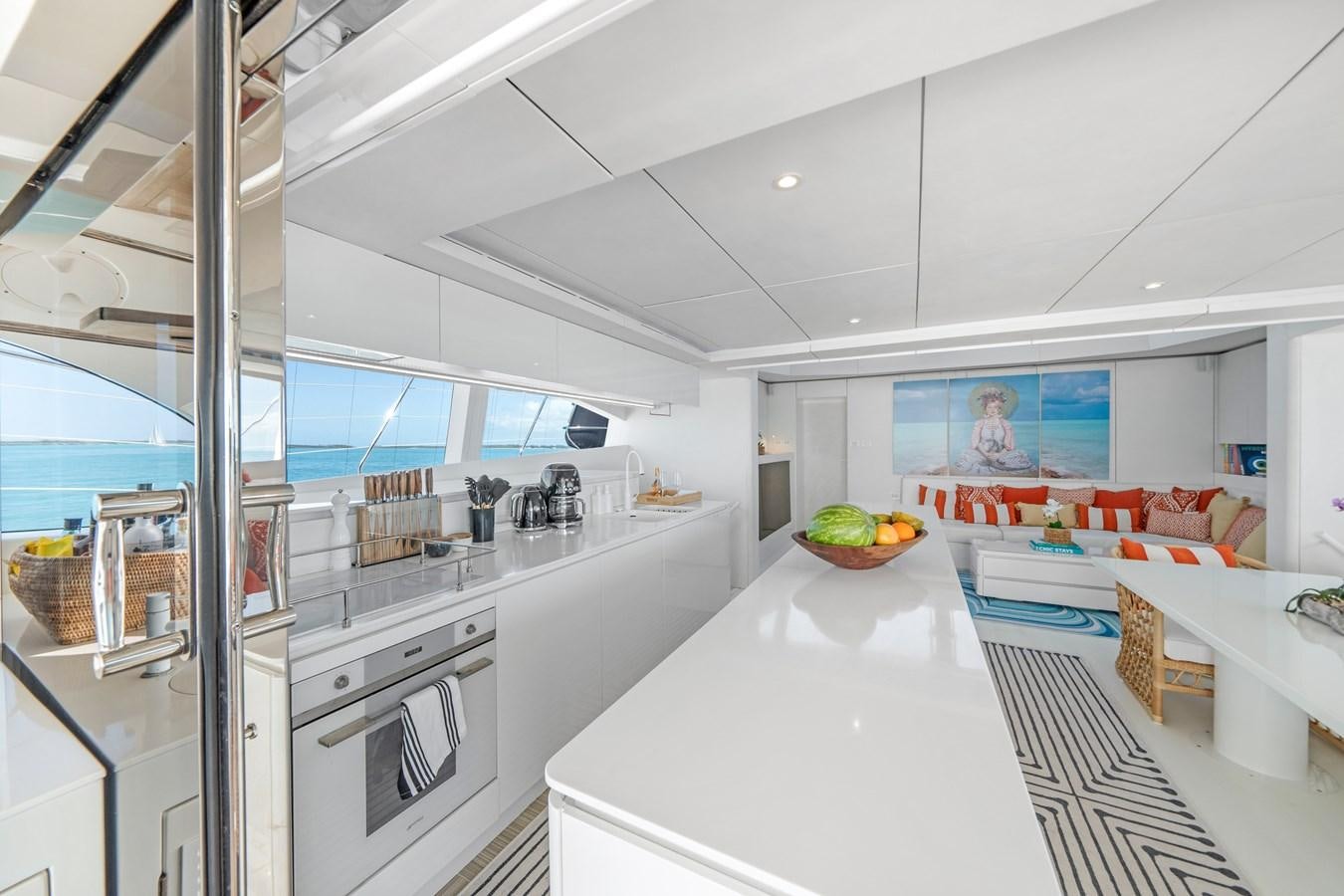 a kitchen with a glass wall aboard ROYAL RITA Yacht for Sale