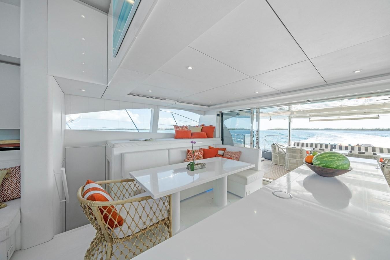 a room with a table and chairs aboard ROYAL RITA Yacht for Sale