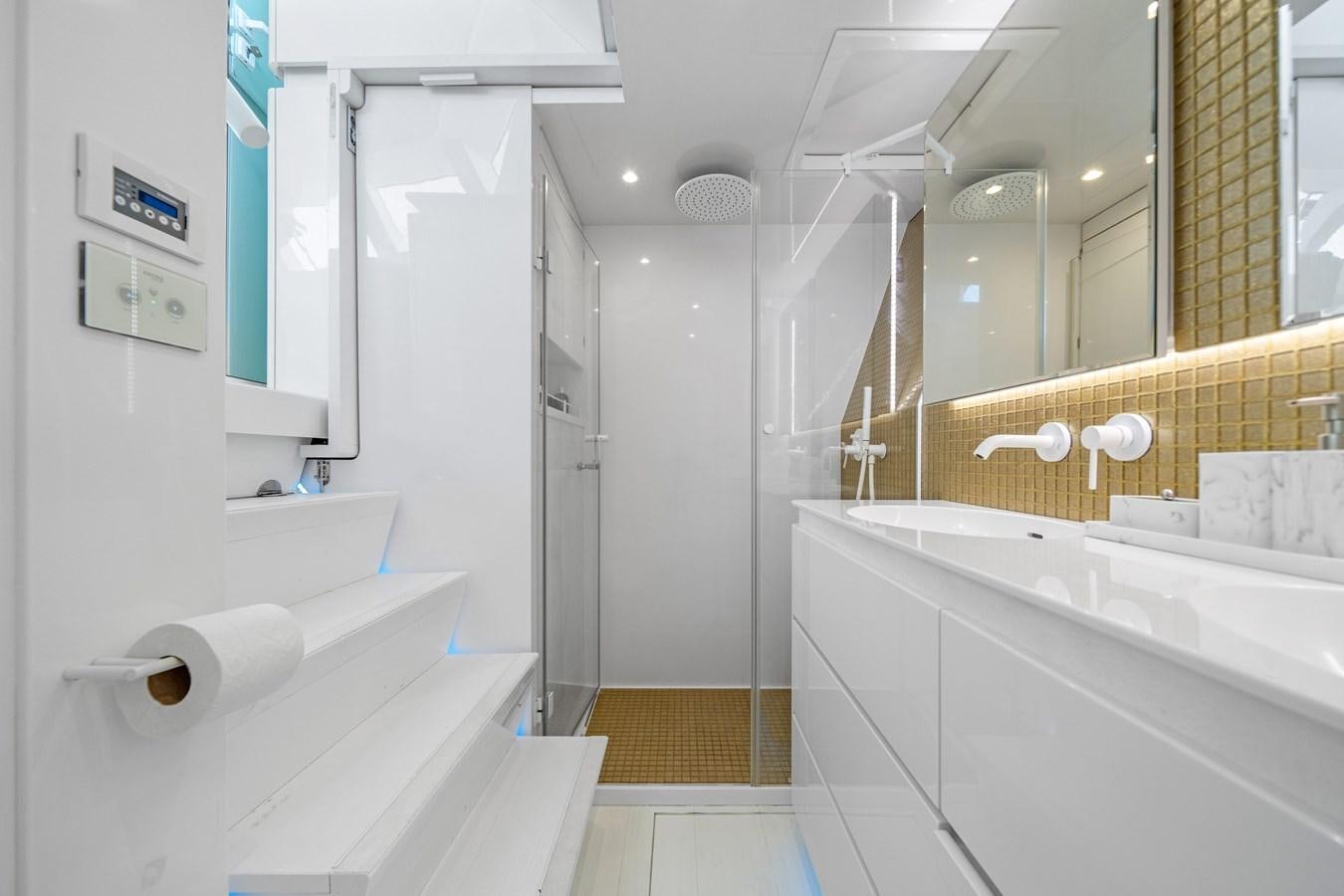 a bathroom with a tub and a sink aboard ROYAL RITA Yacht for Sale