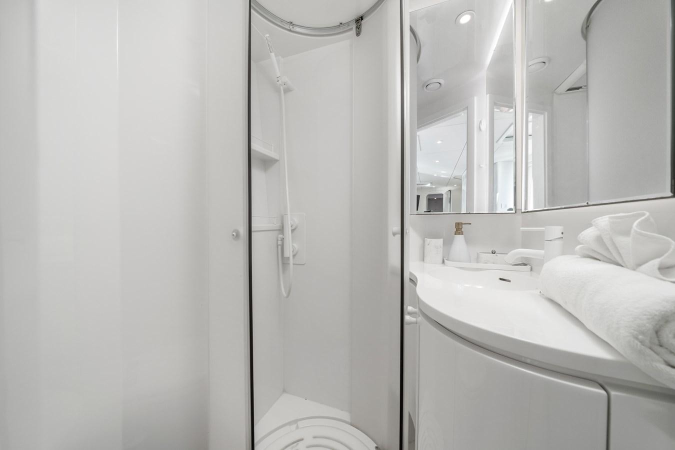 a bathroom with a shower and a sink aboard ROYAL RITA Yacht for Sale