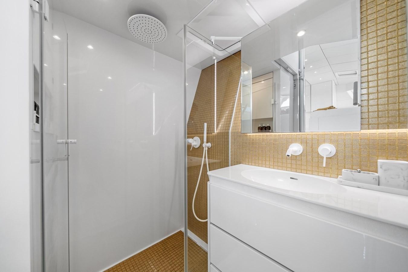 a bathroom with a shower and sink aboard ROYAL RITA Yacht for Sale