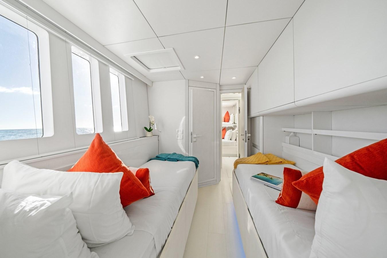 a room with white furniture aboard ROYAL RITA Yacht for Sale