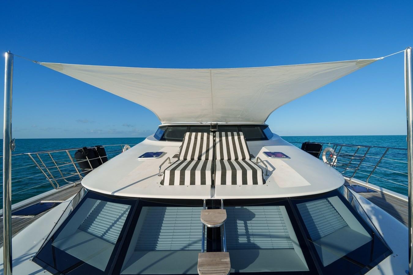 a white yacht on the water aboard ROYAL RITA Yacht for Sale