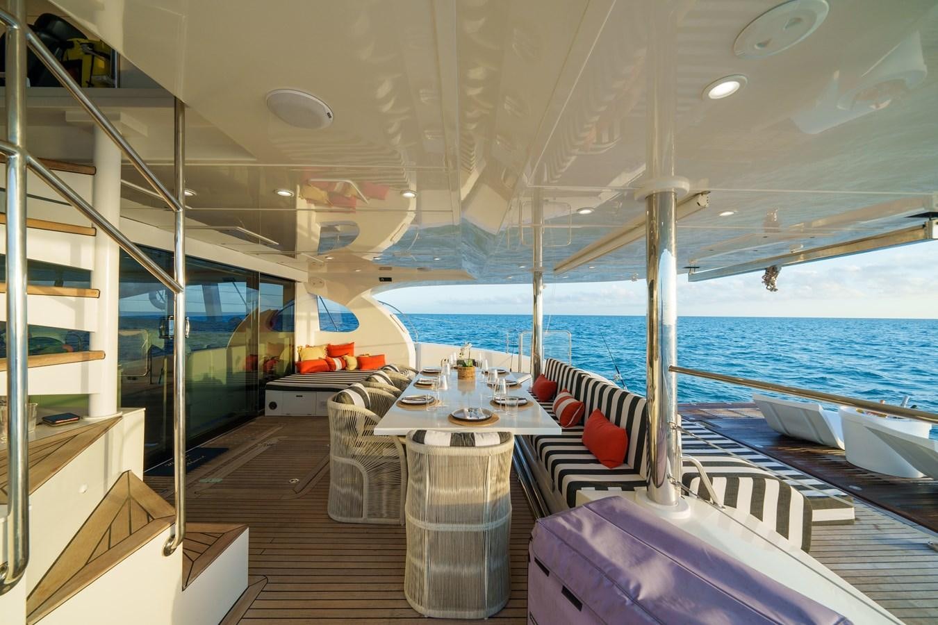 a room with a table and chairs aboard ROYAL RITA Yacht for Sale