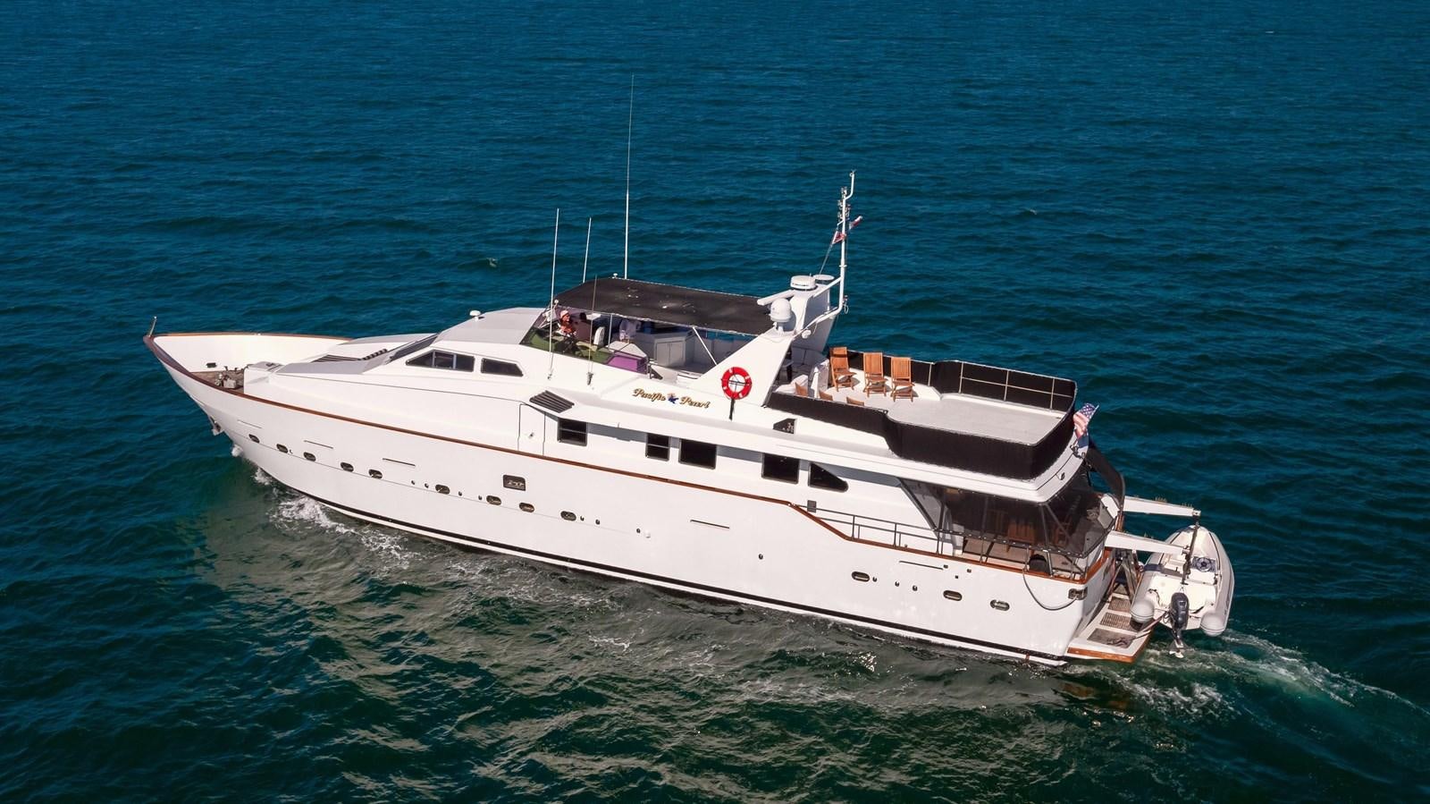 a white boat in the water aboard PACIFIC PEARL Yacht for Sale