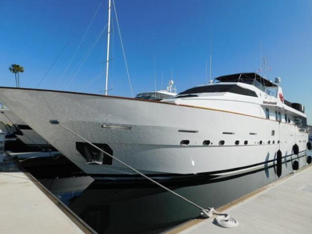 a white yacht on a dock aboard PACIFIC PEARL Yacht for Sale