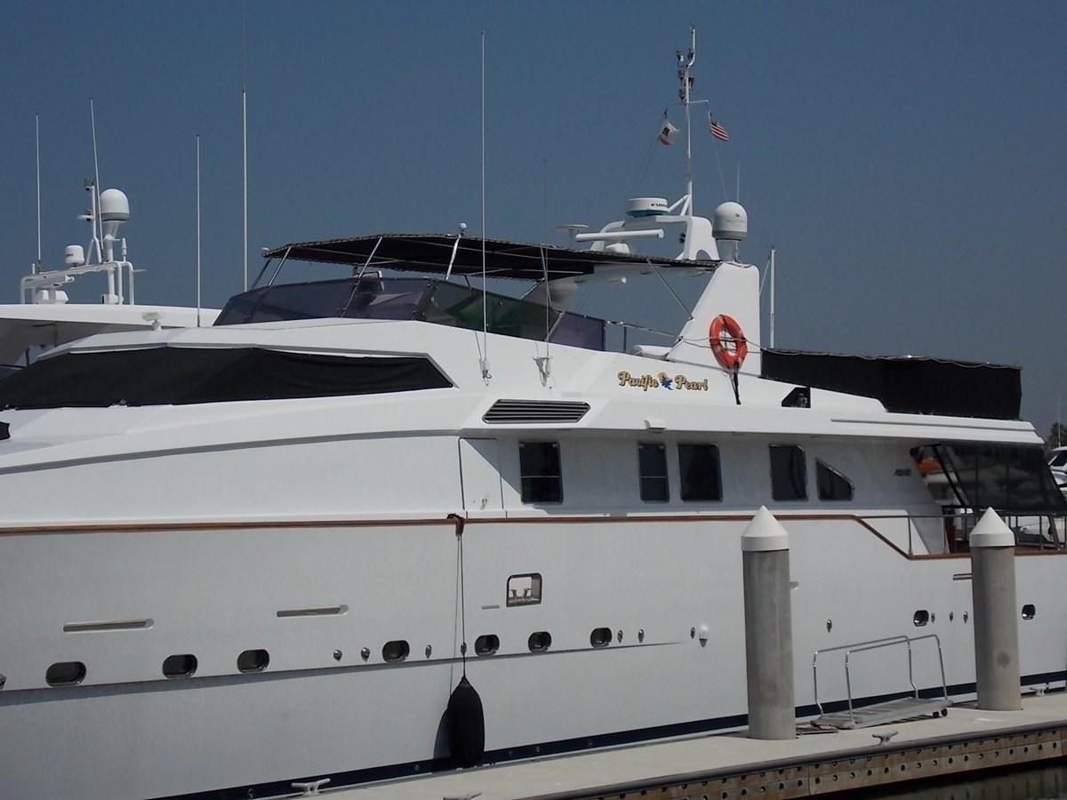a white yacht docked aboard PACIFIC PEARL Yacht for Sale