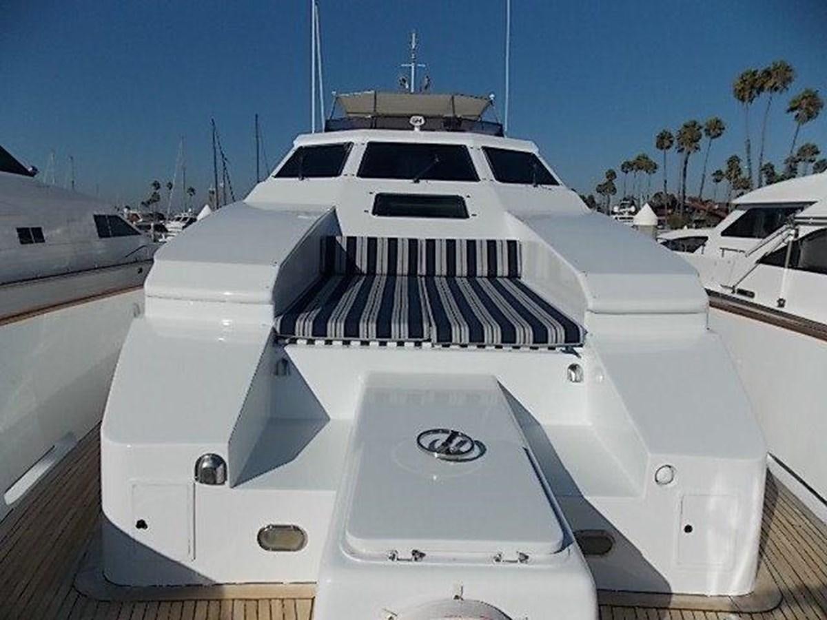 a white yacht in a harbor aboard PACIFIC PEARL Yacht for Sale