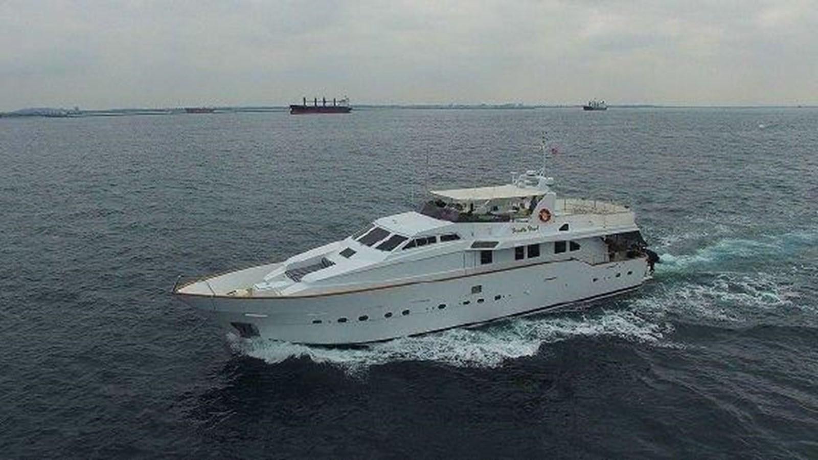 a white yacht in the ocean aboard PACIFIC PEARL Yacht for Sale