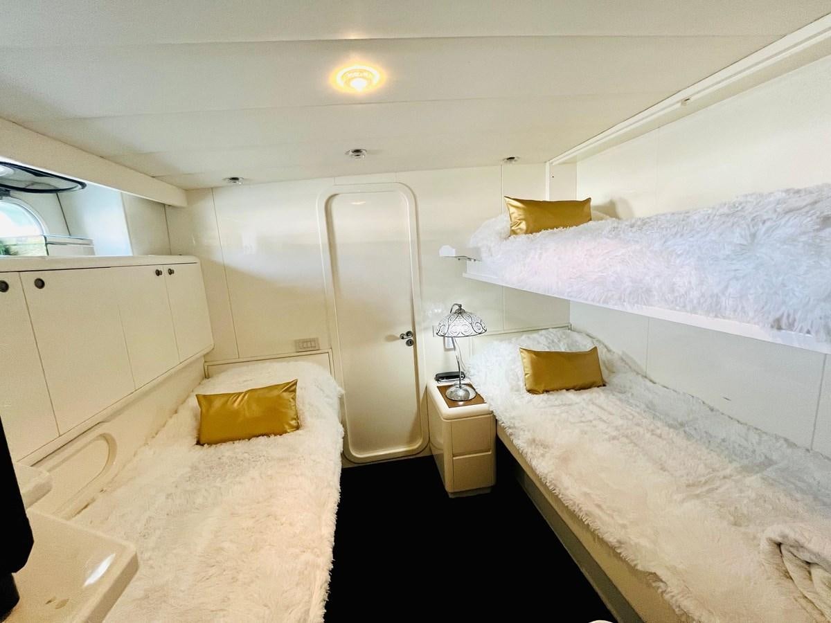 a room with two beds aboard PACIFIC PEARL Yacht for Sale