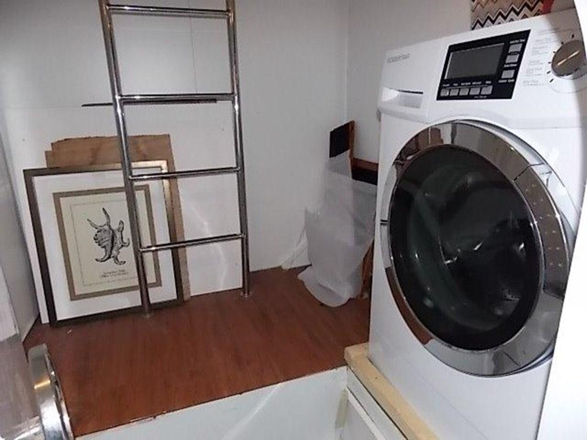 a dryer next to a mirror aboard PACIFIC PEARL Yacht for Sale