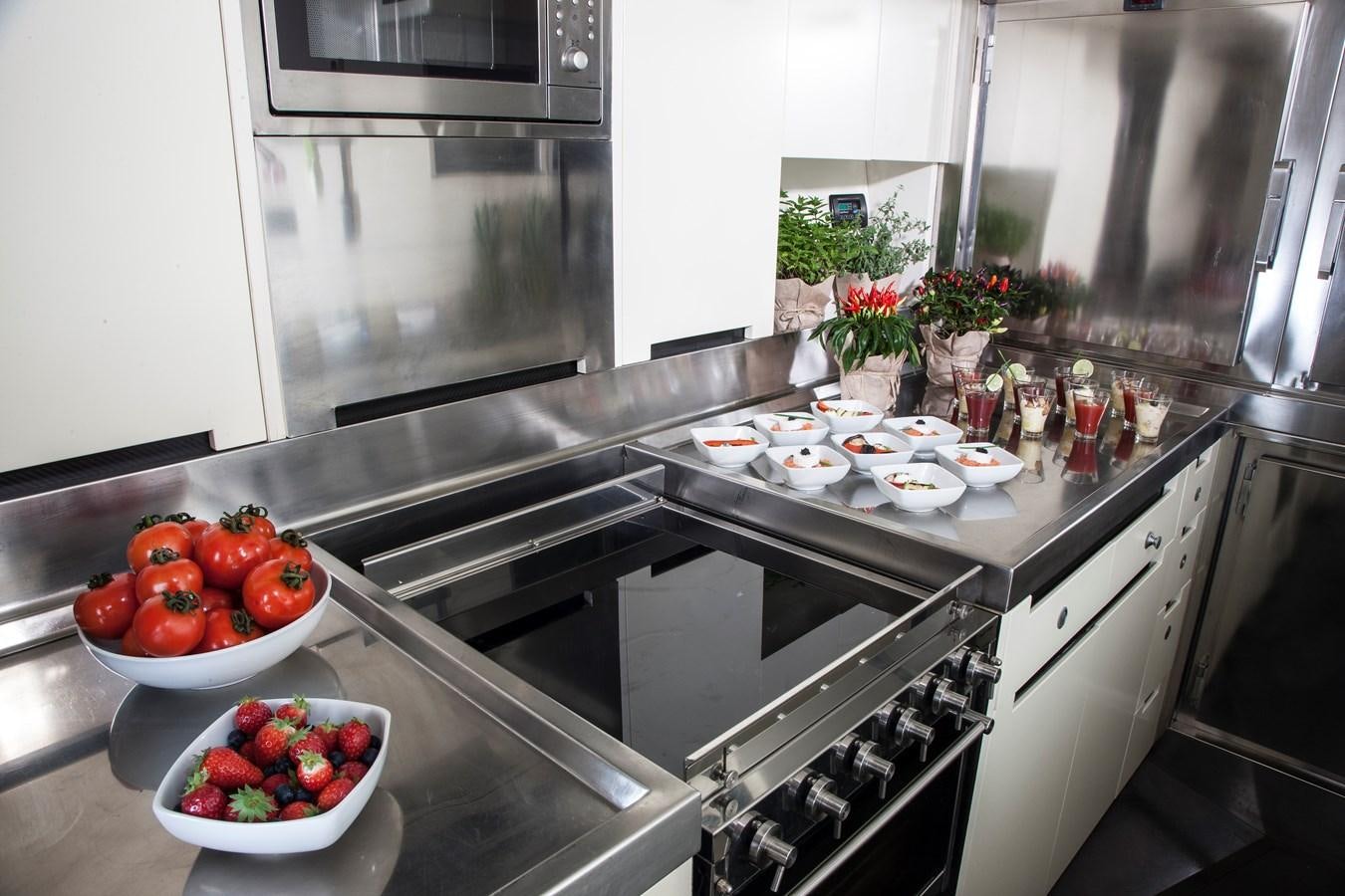 a kitchen with a lot of food aboard INTI CUBE Yacht for Sale