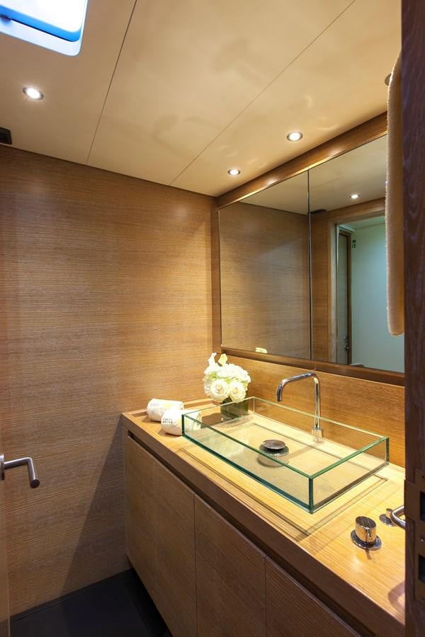 a bathroom with a large mirror aboard INTI CUBE Yacht for Sale