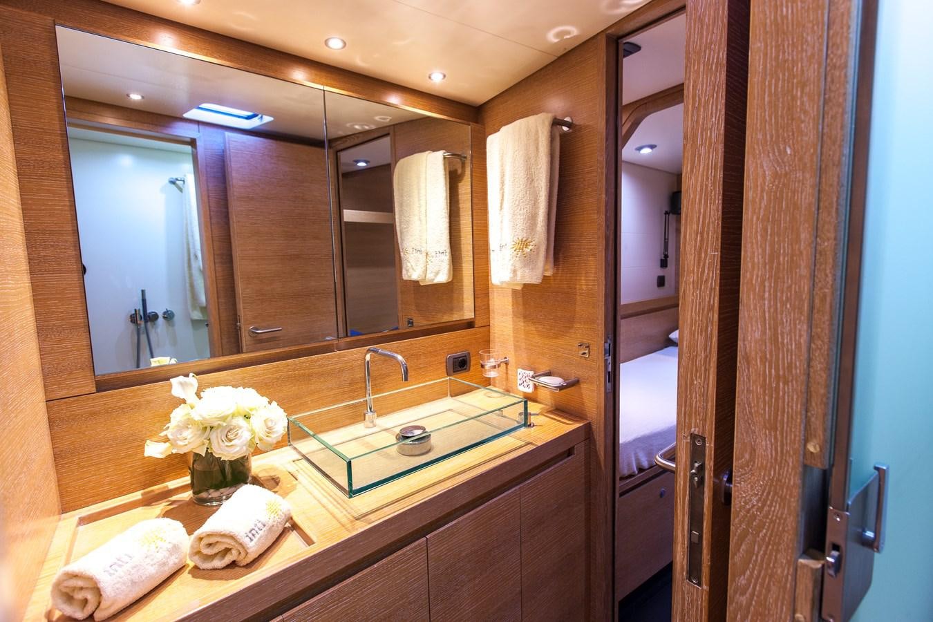 a bathroom with a large mirror aboard INTI CUBE Yacht for Sale