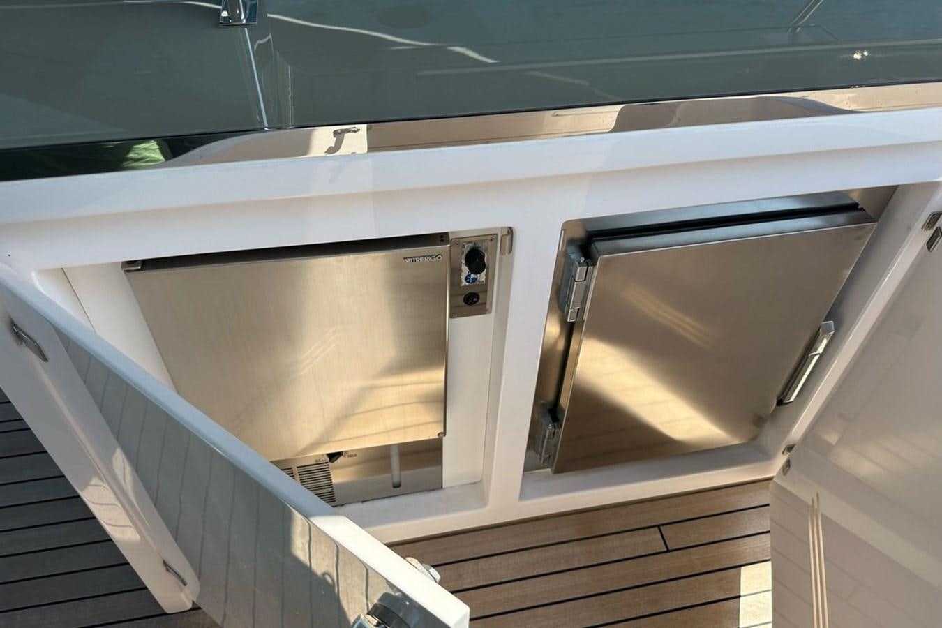 a silver rectangular box on a metal surface aboard REKOMA Yacht for Sale
